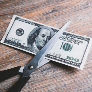 Scissors Cut A Dollar Bill In Half