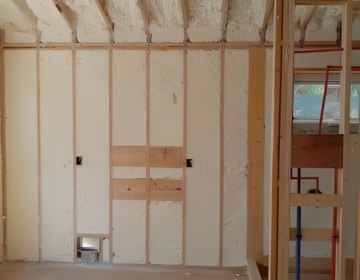 Commercial building insulated with spray foam for energy efficiency