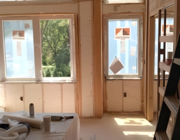 Spray foam insulated interior room improving home insulation performance and indoor comfort