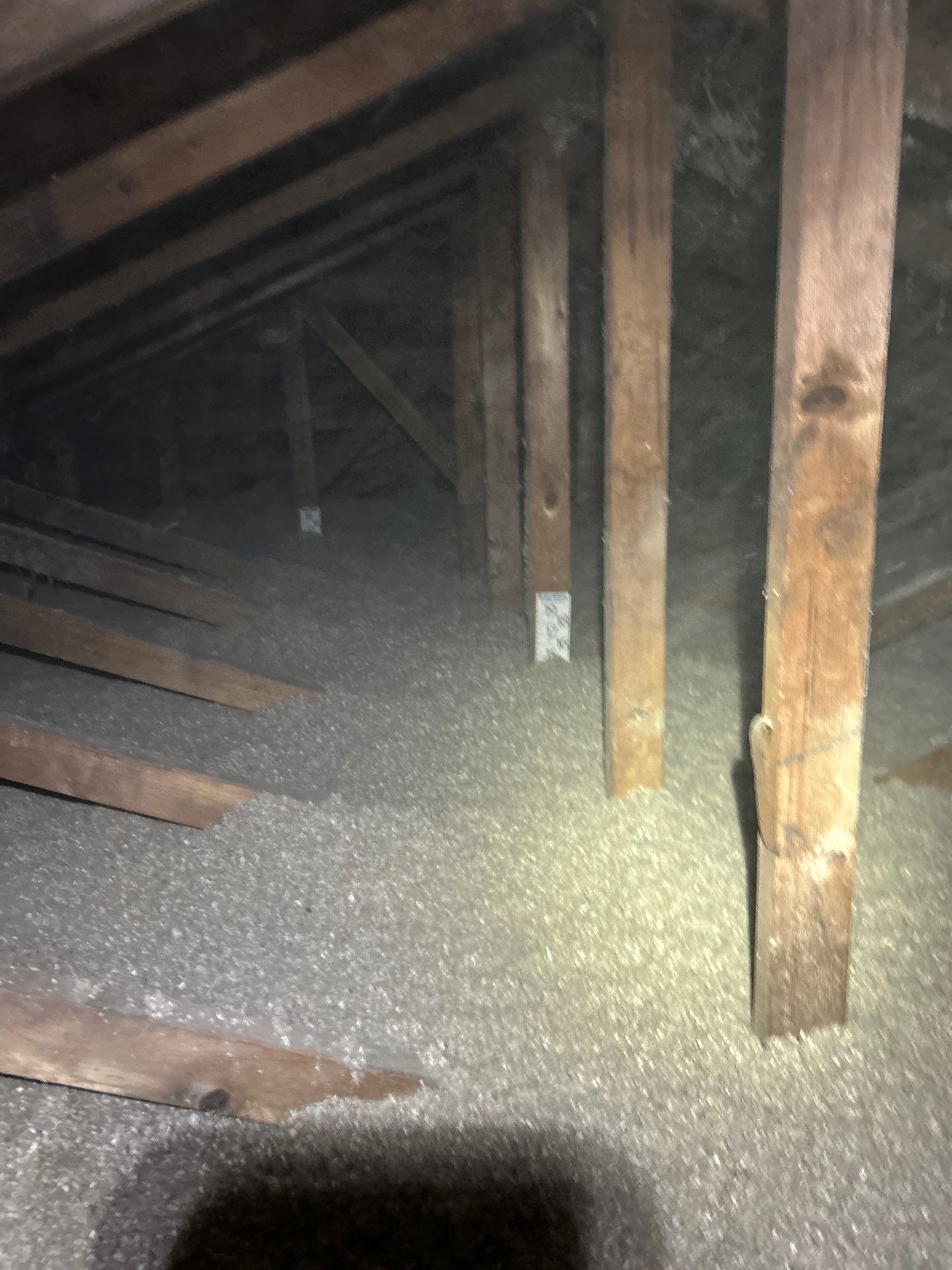 Blown-in loose fill attic insulation installed